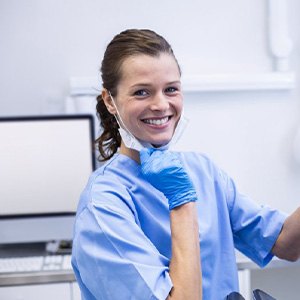 Dental receptionist smiles