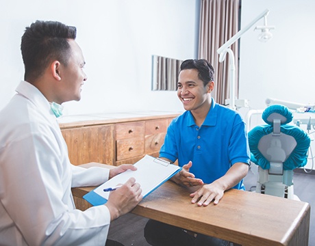  patient talking to dentist about financing options 