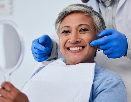 Woman smiling at the dentist’s office