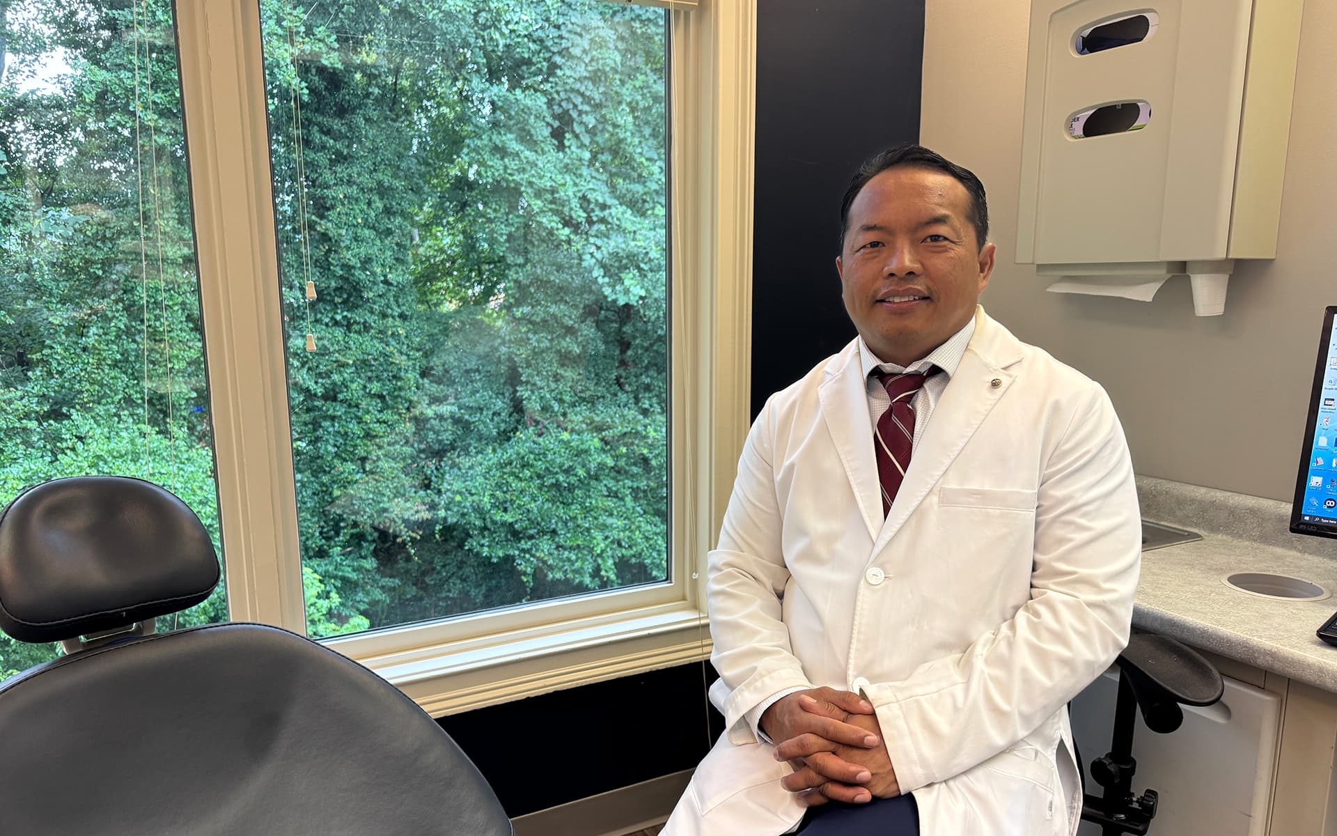 Dr. Shue in a dental exam room